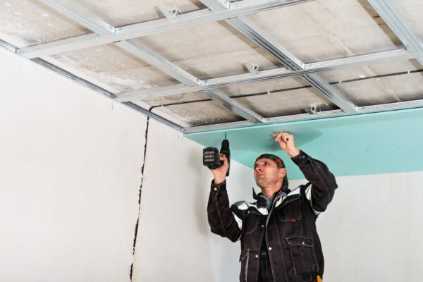 construction-worker-assembly-suspended-ceiling-with-drywall-fixing-drywall-ceiling-metal-frame-with-screwdriver-2048x1366